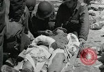 Image of medics aid wounded Marines at Tarawa Tarawa Gilbert Islands, 1943, second 3 stock footage video 65675023680