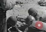 Image of medics aid wounded Marines at Tarawa Tarawa Gilbert Islands, 1943, second 5 stock footage video 65675023680