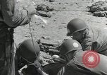 Image of medics aid wounded Marines at Tarawa Tarawa Gilbert Islands, 1943, second 6 stock footage video 65675023680