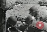 Image of medics aid wounded Marines at Tarawa Tarawa Gilbert Islands, 1943, second 7 stock footage video 65675023680