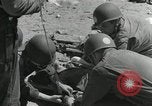 Image of medics aid wounded Marines at Tarawa Tarawa Gilbert Islands, 1943, second 9 stock footage video 65675023680