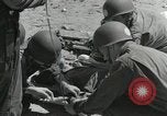 Image of medics aid wounded Marines at Tarawa Tarawa Gilbert Islands, 1943, second 10 stock footage video 65675023680