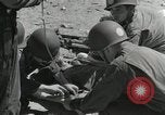 Image of medics aid wounded Marines at Tarawa Tarawa Gilbert Islands, 1943, second 11 stock footage video 65675023680