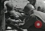 Image of medics aid wounded Marines at Tarawa Tarawa Gilbert Islands, 1943, second 12 stock footage video 65675023680