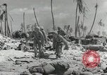 Image of medics aid wounded Marines at Tarawa Tarawa Gilbert Islands, 1943, second 13 stock footage video 65675023680