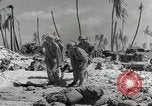 Image of medics aid wounded Marines at Tarawa Tarawa Gilbert Islands, 1943, second 14 stock footage video 65675023680