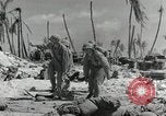 Image of medics aid wounded Marines at Tarawa Tarawa Gilbert Islands, 1943, second 15 stock footage video 65675023680