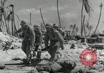 Image of medics aid wounded Marines at Tarawa Tarawa Gilbert Islands, 1943, second 16 stock footage video 65675023680