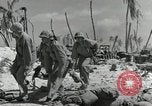 Image of medics aid wounded Marines at Tarawa Tarawa Gilbert Islands, 1943, second 17 stock footage video 65675023680