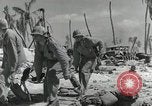 Image of medics aid wounded Marines at Tarawa Tarawa Gilbert Islands, 1943, second 18 stock footage video 65675023680
