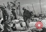 Image of medics aid wounded Marines at Tarawa Tarawa Gilbert Islands, 1943, second 19 stock footage video 65675023680