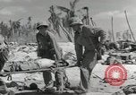 Image of medics aid wounded Marines at Tarawa Tarawa Gilbert Islands, 1943, second 20 stock footage video 65675023680