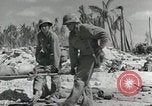 Image of medics aid wounded Marines at Tarawa Tarawa Gilbert Islands, 1943, second 21 stock footage video 65675023680