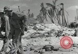 Image of medics aid wounded Marines at Tarawa Tarawa Gilbert Islands, 1943, second 22 stock footage video 65675023680