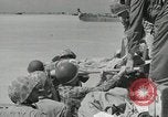 Image of medics aid wounded Marines at Tarawa Tarawa Gilbert Islands, 1943, second 28 stock footage video 65675023680