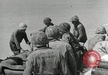 Image of medics aid wounded Marines at Tarawa Tarawa Gilbert Islands, 1943, second 37 stock footage video 65675023680