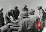 Image of medics aid wounded Marines at Tarawa Tarawa Gilbert Islands, 1943, second 39 stock footage video 65675023680