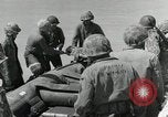 Image of medics aid wounded Marines at Tarawa Tarawa Gilbert Islands, 1943, second 40 stock footage video 65675023680