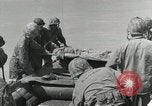 Image of medics aid wounded Marines at Tarawa Tarawa Gilbert Islands, 1943, second 42 stock footage video 65675023680