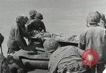 Image of medics aid wounded Marines at Tarawa Tarawa Gilbert Islands, 1943, second 43 stock footage video 65675023680