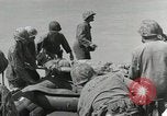 Image of medics aid wounded Marines at Tarawa Tarawa Gilbert Islands, 1943, second 44 stock footage video 65675023680