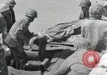 Image of medics aid wounded Marines at Tarawa Tarawa Gilbert Islands, 1943, second 46 stock footage video 65675023680