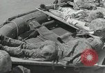 Image of medics aid wounded Marines at Tarawa Tarawa Gilbert Islands, 1943, second 54 stock footage video 65675023680