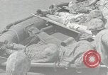Image of medics aid wounded Marines at Tarawa Tarawa Gilbert Islands, 1943, second 55 stock footage video 65675023680