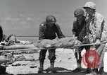 Image of wounded US soldiers at Tarawa Gilbert Islands, 1943, second 48 stock footage video 65675023681