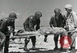 Image of wounded US soldiers at Tarawa Gilbert Islands, 1943, second 49 stock footage video 65675023681