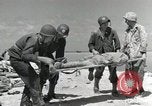 Image of wounded US soldiers at Tarawa Gilbert Islands, 1943, second 50 stock footage video 65675023681