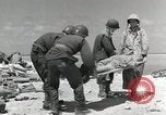 Image of wounded US soldiers at Tarawa Gilbert Islands, 1943, second 51 stock footage video 65675023681