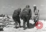 Image of wounded US soldiers at Tarawa Gilbert Islands, 1943, second 52 stock footage video 65675023681