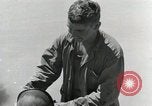 Image of wounded US soldiers at Tarawa Gilbert Islands, 1943, second 58 stock footage video 65675023681