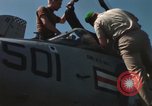 Immagine di Piano capitani tendente a loro aeromobili sulla USS Constellation Sul mare del sud della Cina, 1967, secondo 55 filmato di repertorio 65675023719