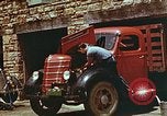 Image of trucker in Harlan Harlan Kentucky USA, 1942, second 15 stock footage video 65675023739