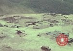 Image of 155mm howitzer slung beneath a CH-54 helicopter Vietnam, 1969, second 4 stock footage video 65675023785