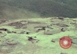 Image of 155mm howitzer slung beneath a CH-54 helicopter Vietnam, 1969, second 5 stock footage video 65675023785