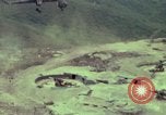 Image of 155mm howitzer slung beneath a CH-54 helicopter Vietnam, 1969, second 9 stock footage video 65675023785