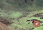 Image of 155mm howitzer slung beneath a CH-54 helicopter Vietnam, 1969, second 11 stock footage video 65675023785