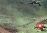 Image of 155mm howitzer slung beneath a CH-54 helicopter Vietnam, 1969, second 12 stock footage video 65675023785