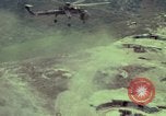 Image of 155mm howitzer slung beneath a CH-54 helicopter Vietnam, 1969, second 16 stock footage video 65675023785