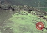 Image of 155mm howitzer slung beneath a CH-54 helicopter Vietnam, 1969, second 19 stock footage video 65675023785