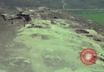 Image of 155mm howitzer slung beneath a CH-54 helicopter Vietnam, 1969, second 20 stock footage video 65675023785