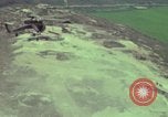 Image of 155mm howitzer slung beneath a CH-54 helicopter Vietnam, 1969, second 21 stock footage video 65675023785