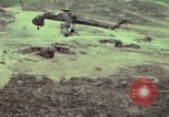 Image of 155mm howitzer slung beneath a CH-54 helicopter Vietnam, 1969, second 24 stock footage video 65675023785