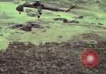 Image of 155mm howitzer slung beneath a CH-54 helicopter Vietnam, 1969, second 25 stock footage video 65675023785