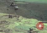 Image of 155mm howitzer slung beneath a CH-54 helicopter Vietnam, 1969, second 30 stock footage video 65675023785