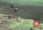 Image of 155mm howitzer slung beneath a CH-54 helicopter Vietnam, 1969, second 31 stock footage video 65675023785