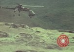 Image of 155mm howitzer slung beneath a CH-54 helicopter Vietnam, 1969, second 40 stock footage video 65675023785